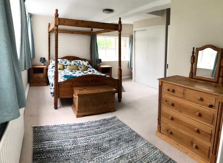 Master bedroom at Fell Foot with king-size four-poster bed