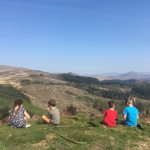 Children eating a picnic on top of Irton Pike