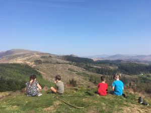 Children eating a picnic on top of Irton Pike